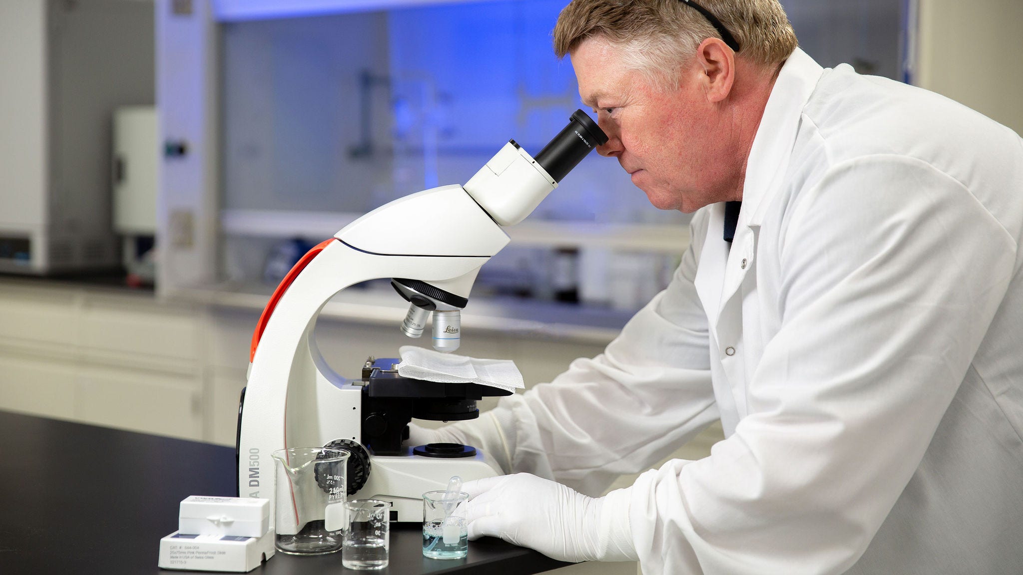 Scientist looking in a microscope